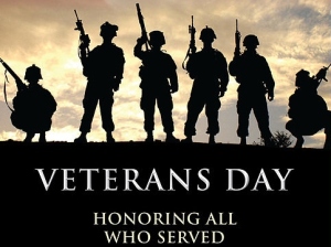 Veterans Day poster of silhouettes of soldiers against a sky