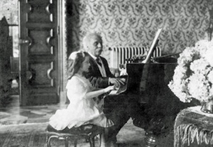 Gabriel Faure playing piano four hands with Mlle. Lombard, 1913
