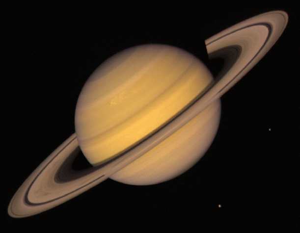 Image of Saturn, its rings, and moons taken by the Voyager spacecraft.